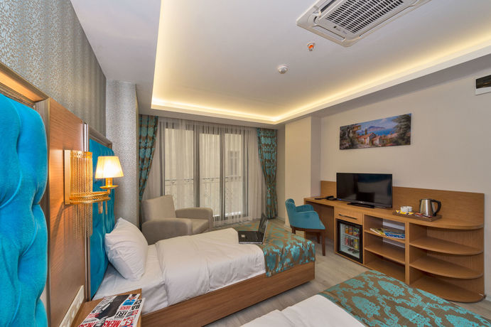 Imagen de la habitación del Grand Palace Hotel. Foto 11