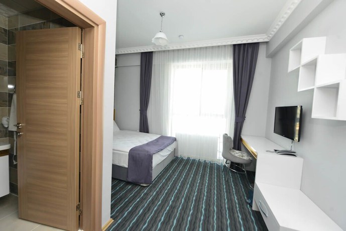 Imagen de la habitación del Grand Surmely Business Hotel. Foto 11