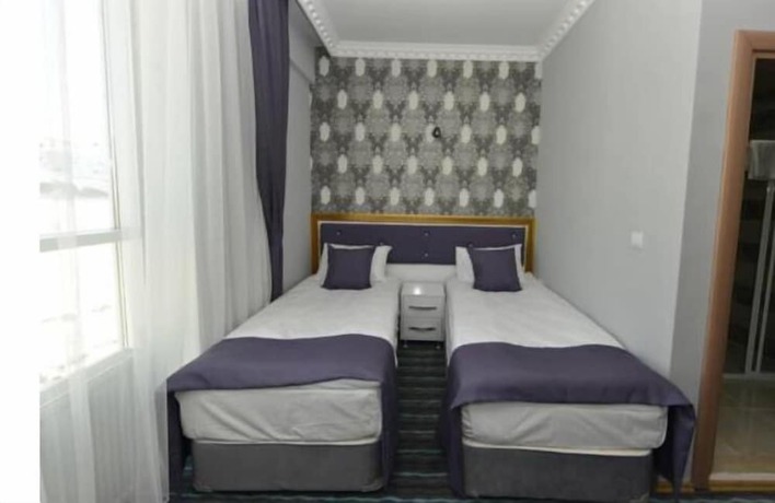 Imagen de la habitación del Grand Surmely Business Hotel. Foto 12