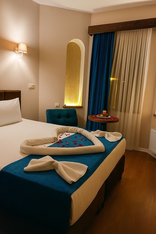 Imagen de la habitación del Grand U&ccedil;hisar Hotel. Foto 8