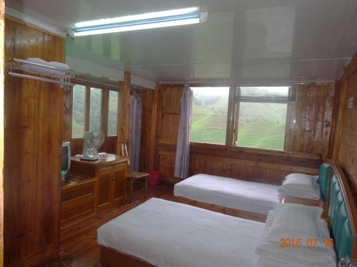 Imagen de la habitación del Guilin Longji Xin Jia Yuan Hotel. Foto 7