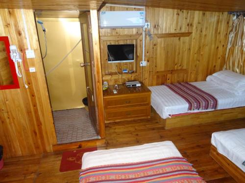 Imagen de la habitación del Guilin Longji Xin Jia Yuan Hotel. Foto 8