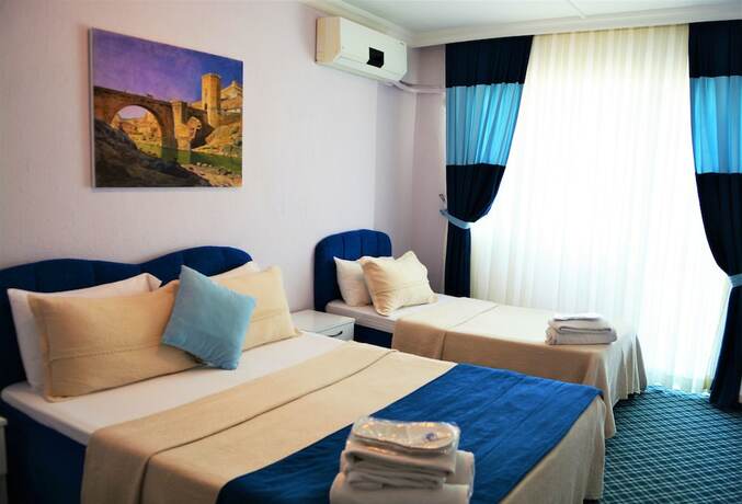 Imagen de la habitación del Gumuldur Mavi Deniz Otel. Foto 19