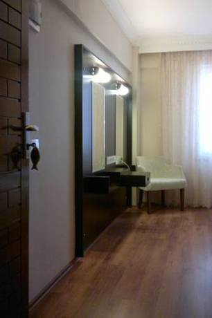 Imagen de la habitación del Gumus Hotel, Ayvacık. Foto 6