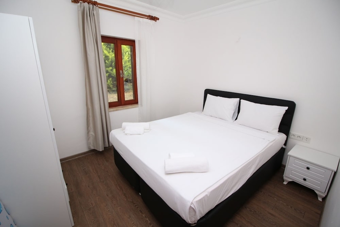 Imagen de la habitación del Gumusluk Tramonto Evleri. Foto 4