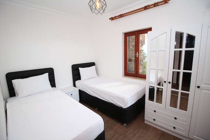 Imagen de la habitación del Gumusluk Tramonto Evleri. Foto 5