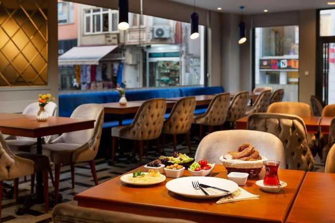 Imagen del bar/restaurante del Guner Business Hotel. Foto 2