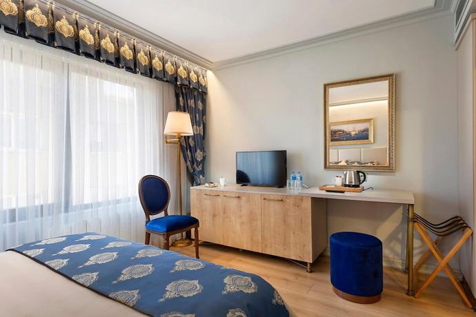 Imagen de la habitación del Guner Business Hotel. Foto 11