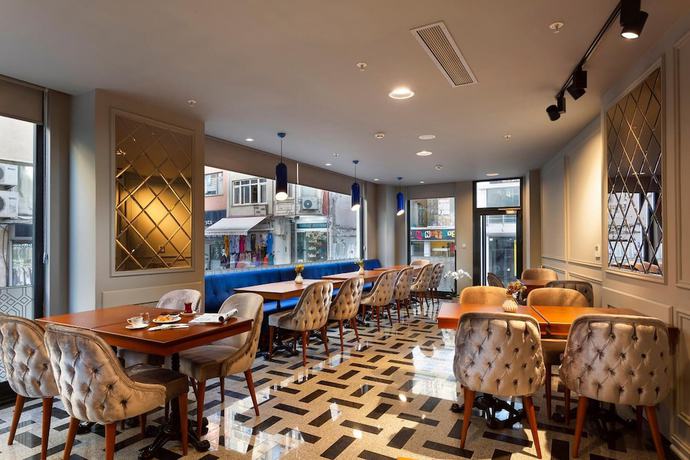 Imagen del bar/restaurante del Guner Business Hotel. Foto 3