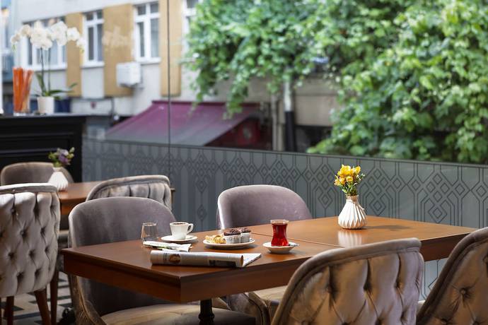 Imagen del bar/restaurante del Guner Business Hotel. Foto 4