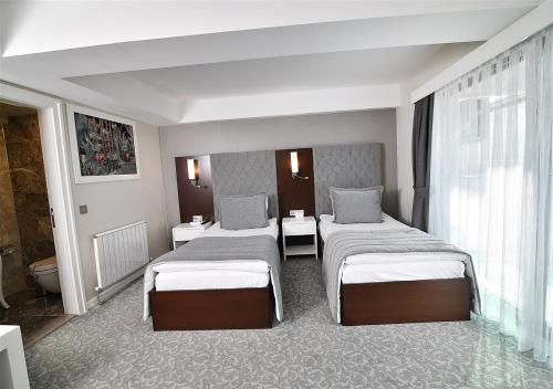 Imagen de la habitación del Guvenay Business Hotel. Foto 8