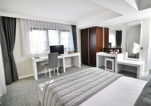 Imagen de la habitación del Guvenay Business Hotel. Foto 10