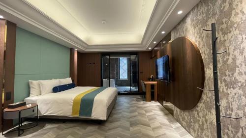 Imagen de la habitación del H Motel璽悅國際精品旅館. Foto 15
