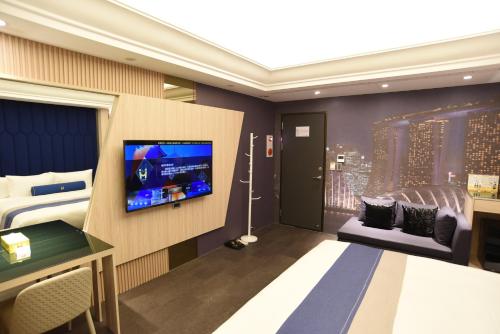 Imagen de la habitación del H Motel璽悅國際精品旅館. Foto 19