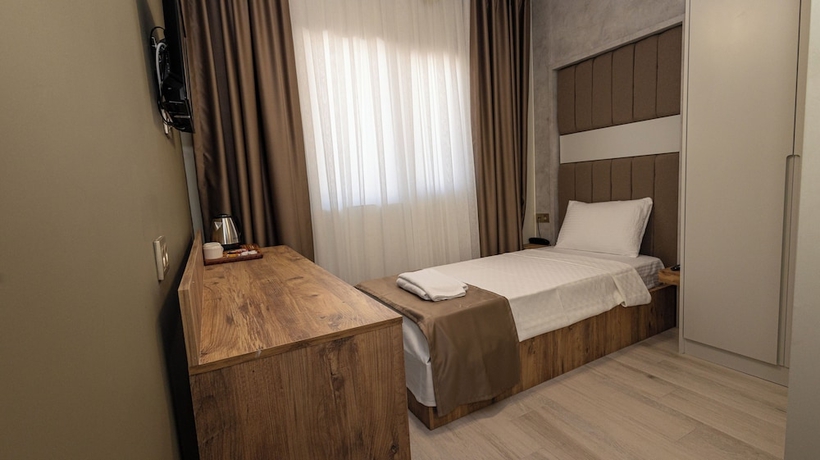Imagen de la habitación del HOLMİ OTEL. Foto 7