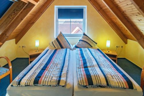 Imagen de la habitación del HOTEL DÜNENLÄUFER Carolinensiel. Foto 9