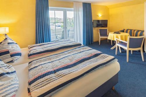 Imagen de la habitación del HOTEL DÜNENLÄUFER Carolinensiel. Foto 11