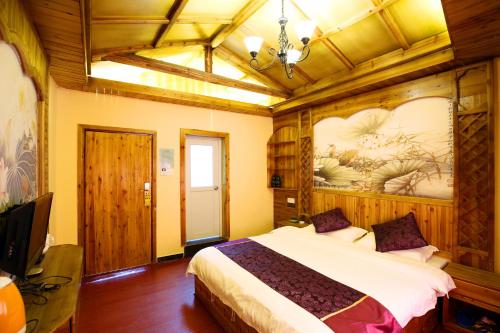 Imagen de la habitación del Hanmoyaxuanjiangjing Inn. Foto 7