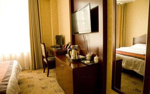 Imagen de la habitación del Hemei Business Hotel. Foto 6