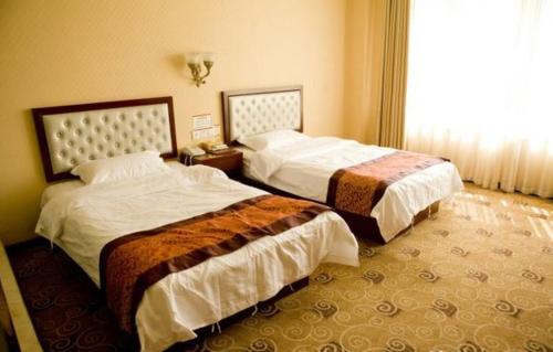 Imagen de la habitación del Hemei Business Hotel. Foto 8