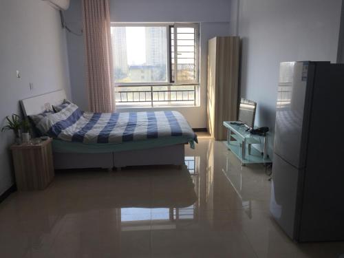 Imagen de la habitación del Hengshui Lehui Apartment. Foto 9