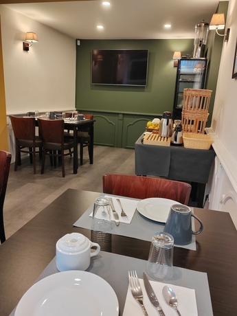 Imagen del bar/restaurante del H&ocirc;tel Au Grand Duquesne. Foto 4