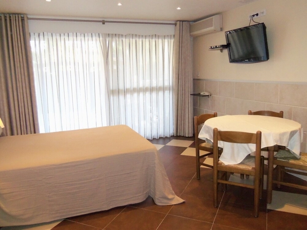 Imagen de la habitación del Hôtel Et Studios Les Amandiers. Foto 10