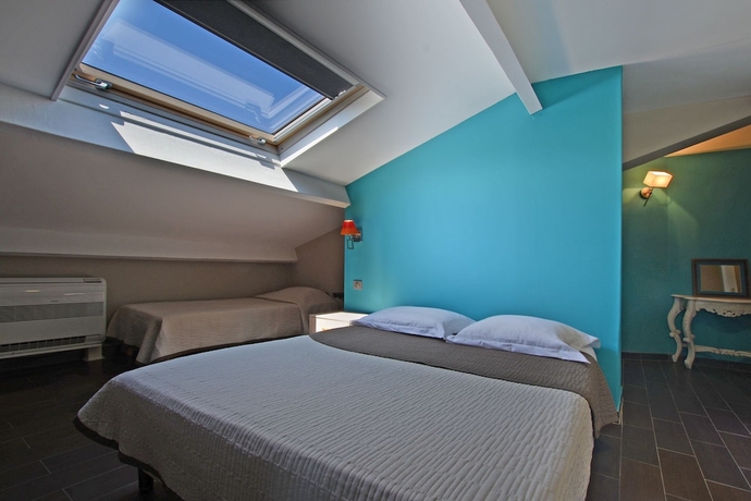 Imagen de la habitación del Hôtel La Palma. Foto 8