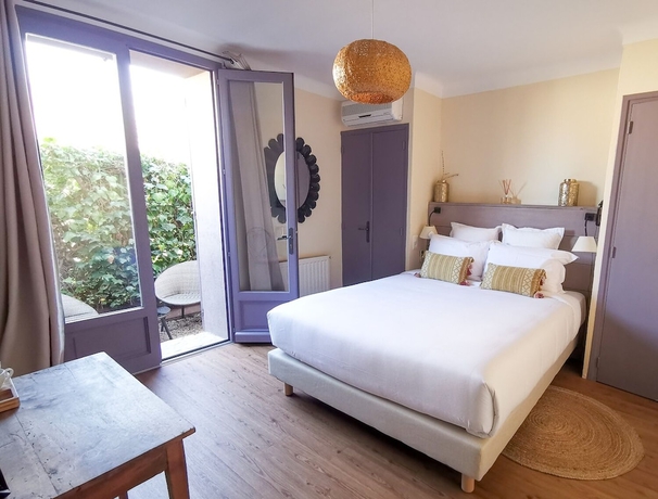 Imagen de la habitación del H&ocirc;tel Sous Les Figuiers. Foto 7