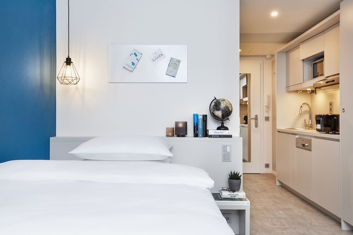 Imagen de la habitación del H.ome Serviced Apartments München. Foto 12