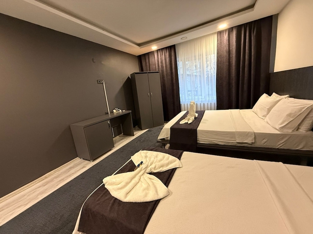 Imagen de la habitación del Home Suit apart otel. Foto 5