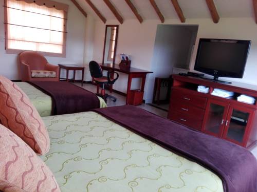 Imagen de la habitación del Hospederia El Portal De Las Flores, Chia. Foto 3
