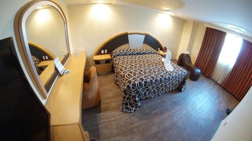 Imagen de la habitación del Hot Plaza Camarones - Love Hotel - Solo Adultos. Foto 16