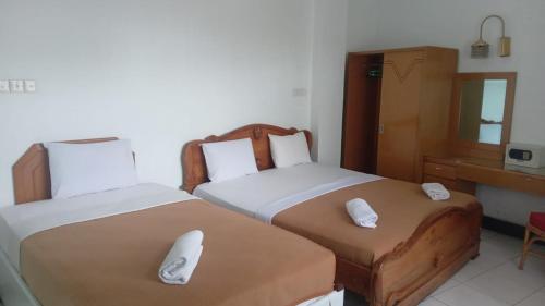 Imagen de la habitación del Hotel Asia Bukittinggi. Foto 16