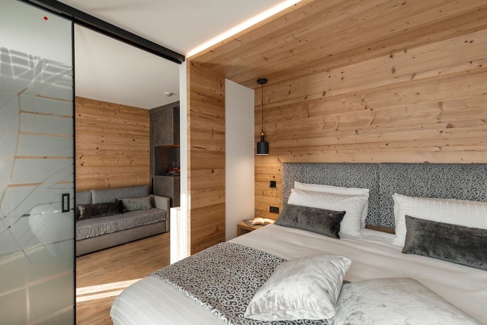 Imagen de la habitación del Hotel Belvedere, San Martino di Castrozza. Foto 10