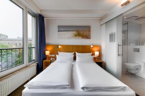 Imagen de la habitación del Hotel Berlin Mitte by Coffee Fellows. Foto 15