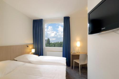 Imagen de la habitación del Hotel Berlin Mitte by Coffee Fellows. Foto 19