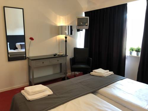 Imagen de la habitación del Hotel De Kroon. Foto 3