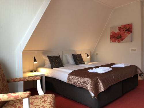 Imagen de la habitación del Hotel De Kroon. Foto 5