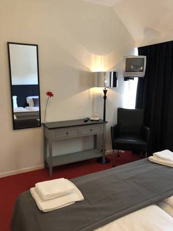 Imagen de la habitación del Hotel De Kroon. Foto 15