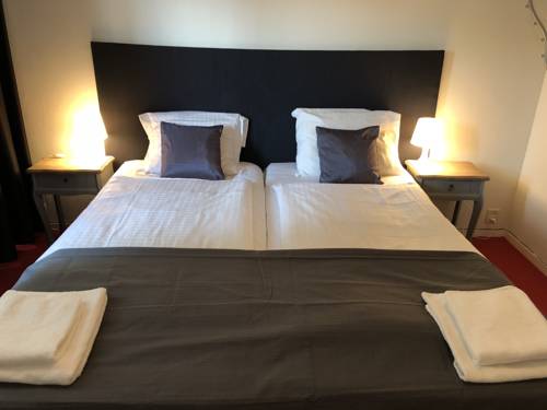 Imagen de la habitación del Hotel De Kroon. Foto 16