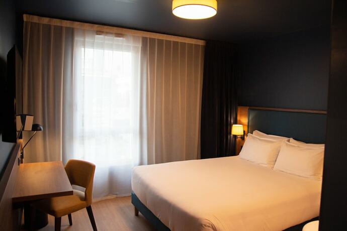 Imagen de la habitación del Hotel De La Cité. Foto 17