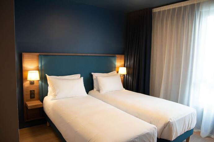 Imagen de la habitación del Hotel De La Cité. Foto 18