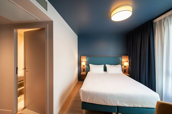 Imagen de la habitación del Hotel De La Cité. Foto 20