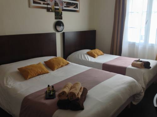 Imagen de la habitación del Hotel De La Paix, Caen. Foto 8