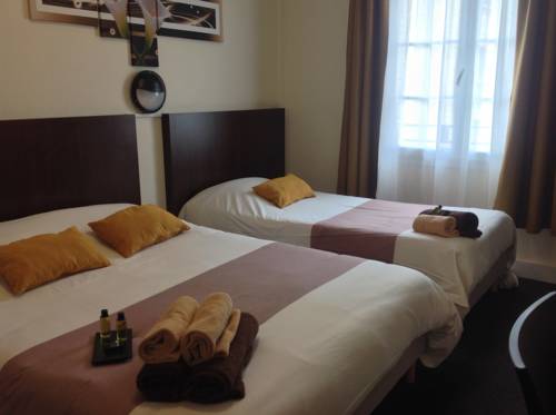 Imagen de la habitación del Hotel De La Paix, Caen. Foto 12