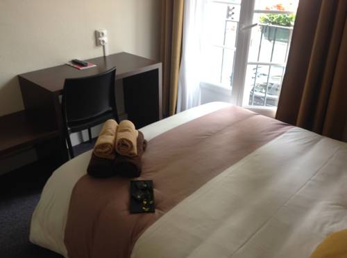 Imagen de la habitación del Hotel De La Paix. Foto 16