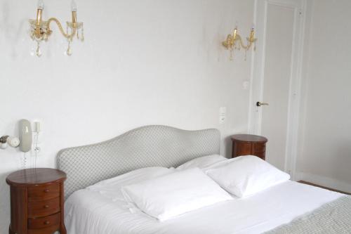 Imagen de la habitación del Hotel De La Poste, Mortain-Bocage. Foto 7