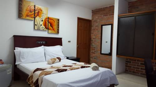 Imagen de la habitación del Hotel El Sol La 27. Foto 6