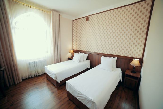 Imagen de la habitación del Hotel Erkin Palace. Foto 8